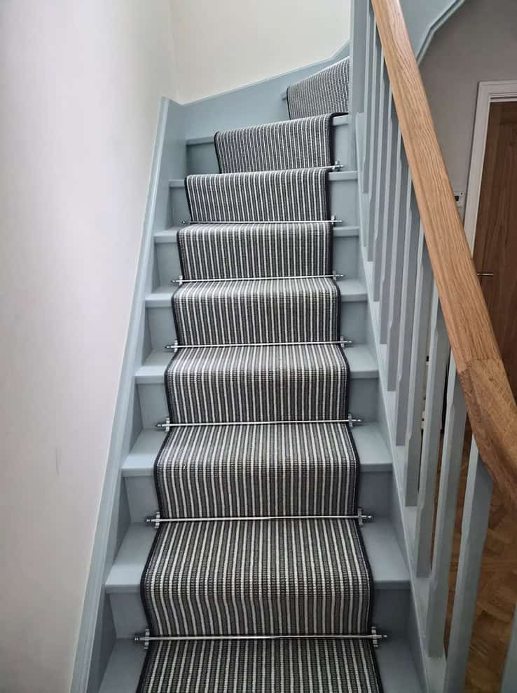 Recent fitted carpet installation in a finished room.