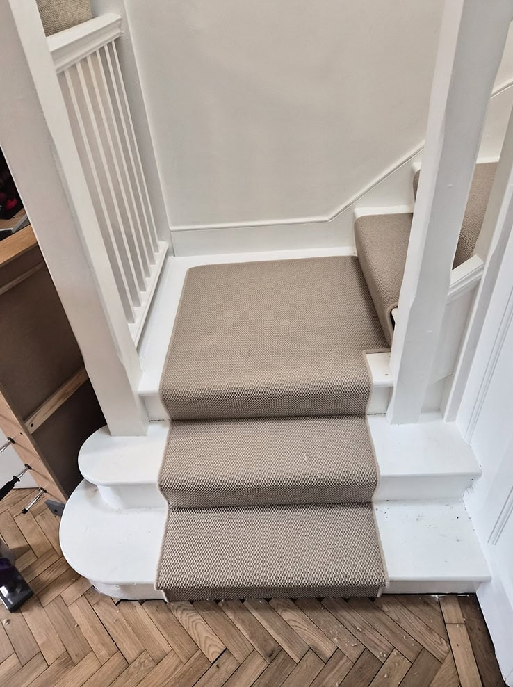 Freshly installed carpet with clean edges and finish.