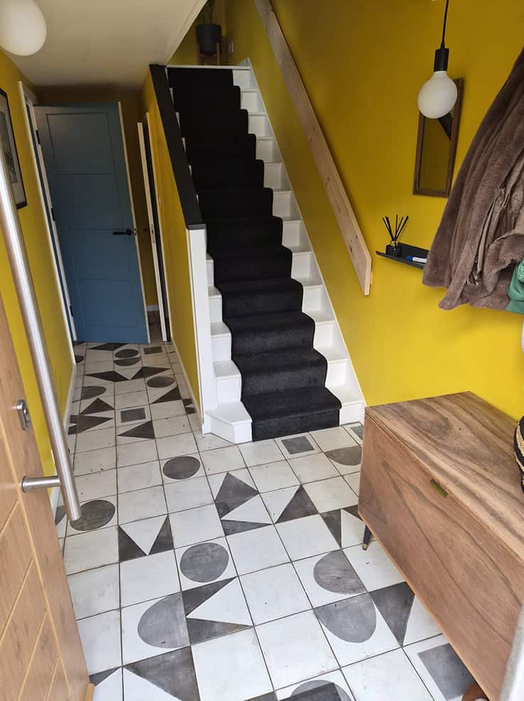 Professional carpet fitting in a bright interior.