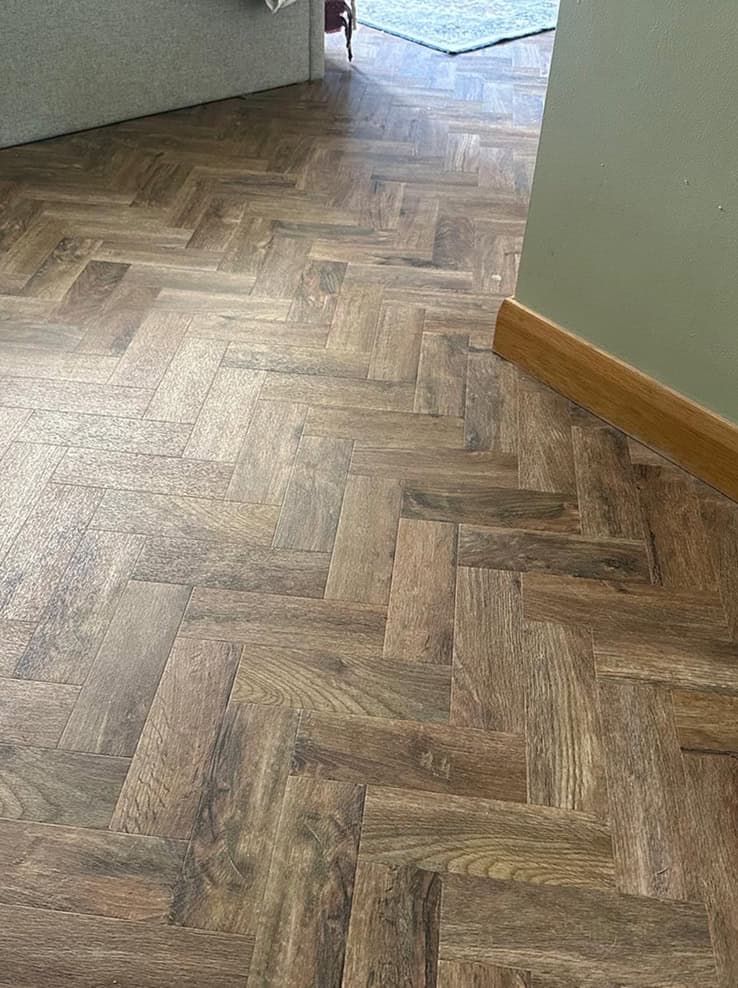 Freshly installed flooring detail in a modern room.