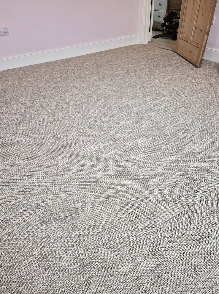 Finished flooring project with clean fitted edges.
