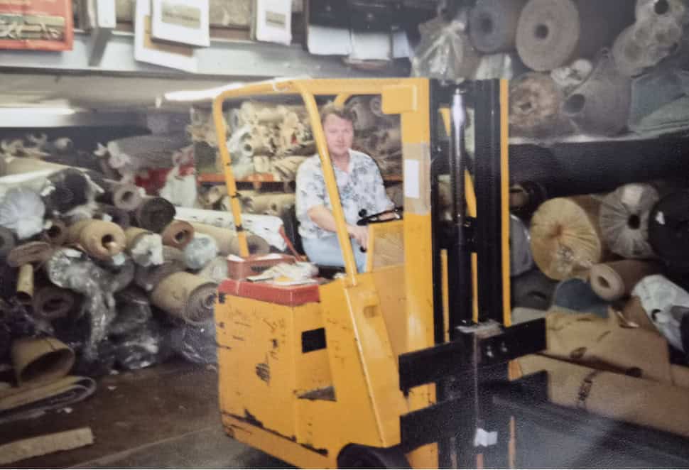 Historic warehouse interior showing flooring stock and displays.